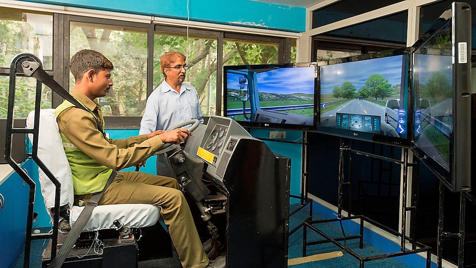 a guy experimenting on virtual reality for driving