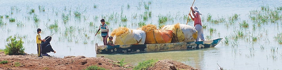 Local people on the Yabani Canal in the South of Iraq